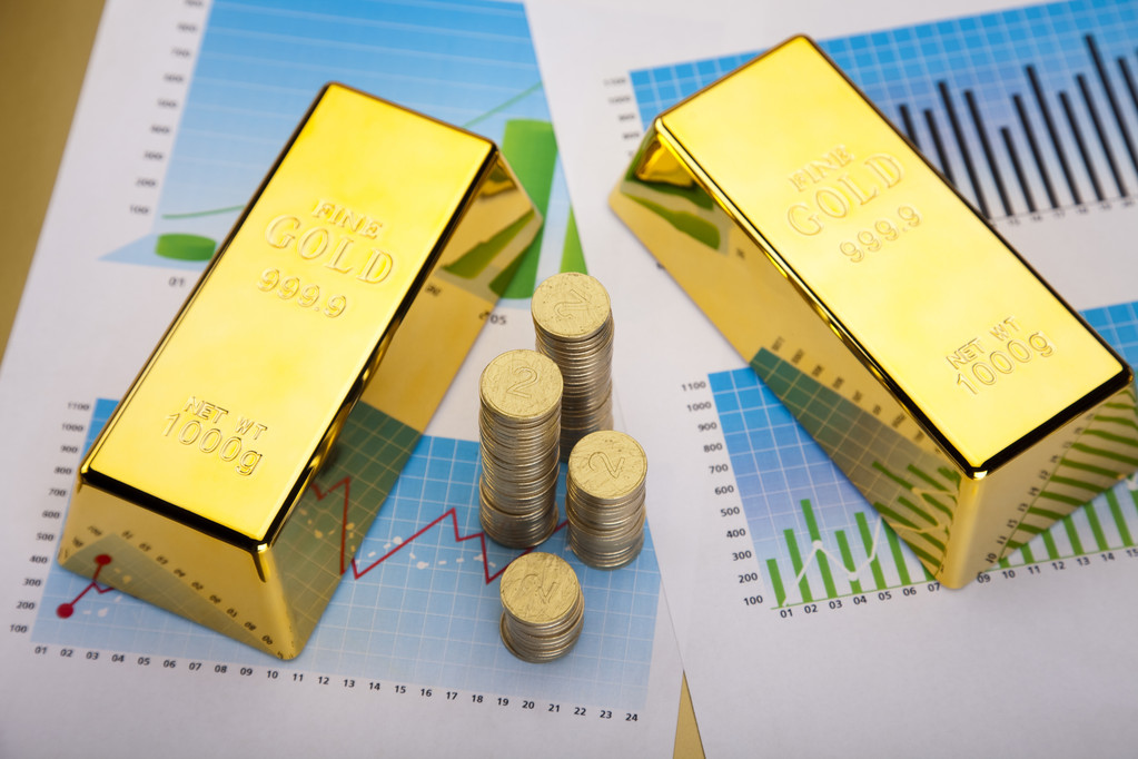 现货黄金震荡回落 美国11月通胀率符合预期
